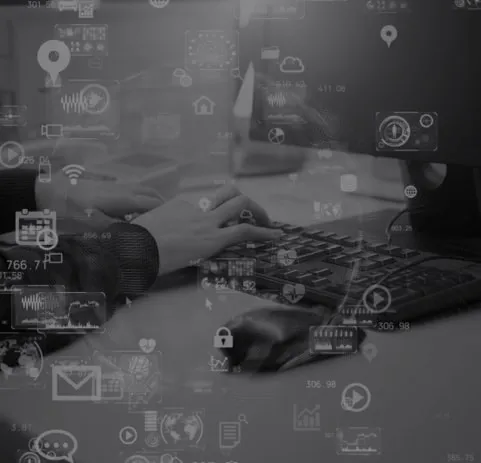 Hands typing on a keyboard with digital icons and data overlays representing technology, analytics, and cybersecurity.